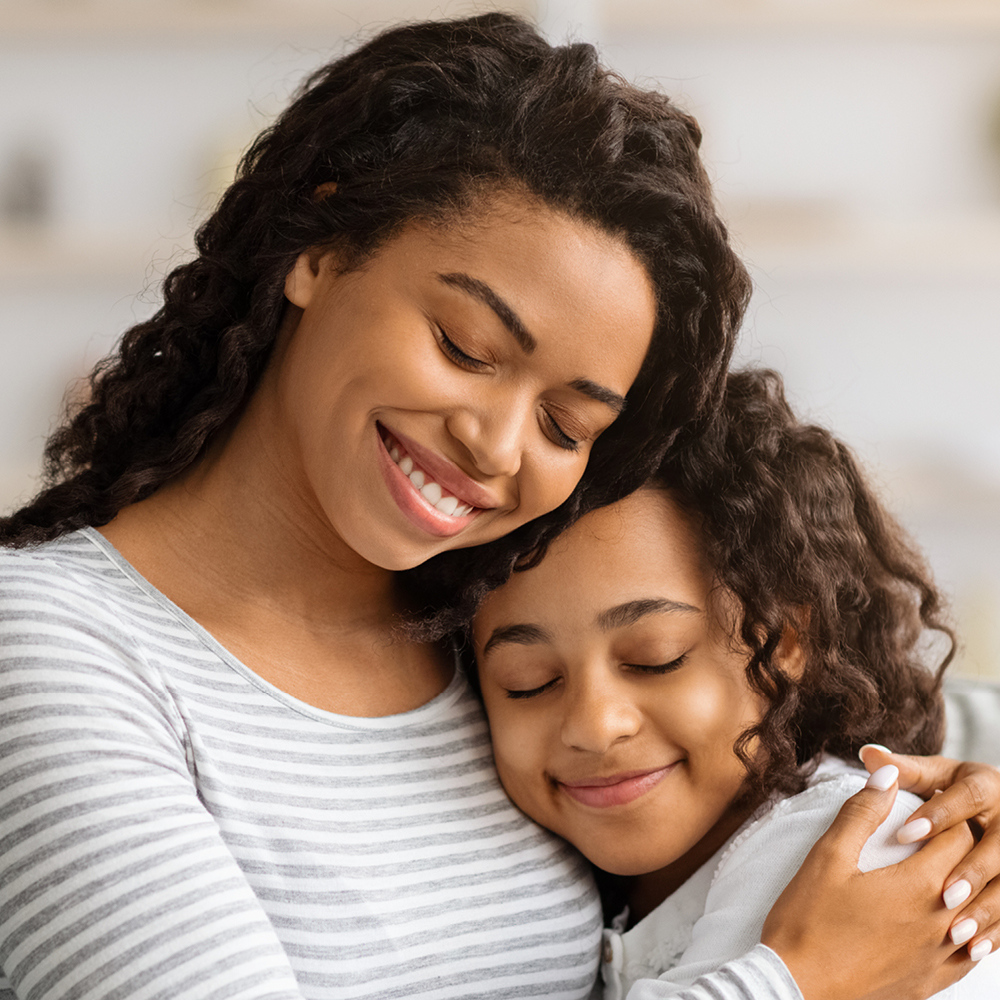 Mom and daughter hugging