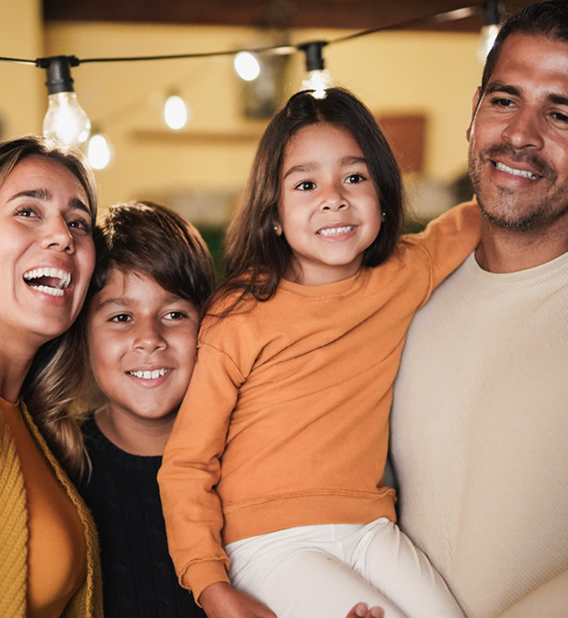 Grandfather with two children high fiving