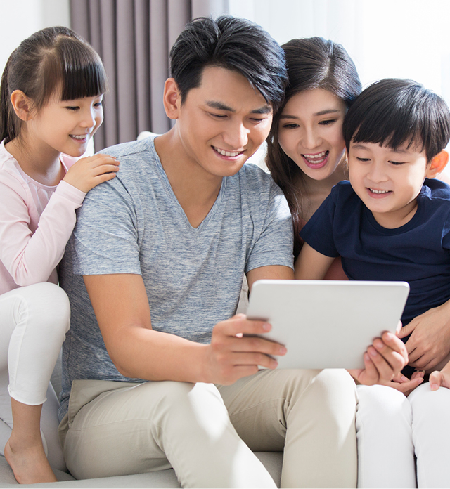 Family looking at a tablet