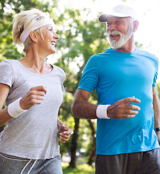 Elderly Couple Jogging Together